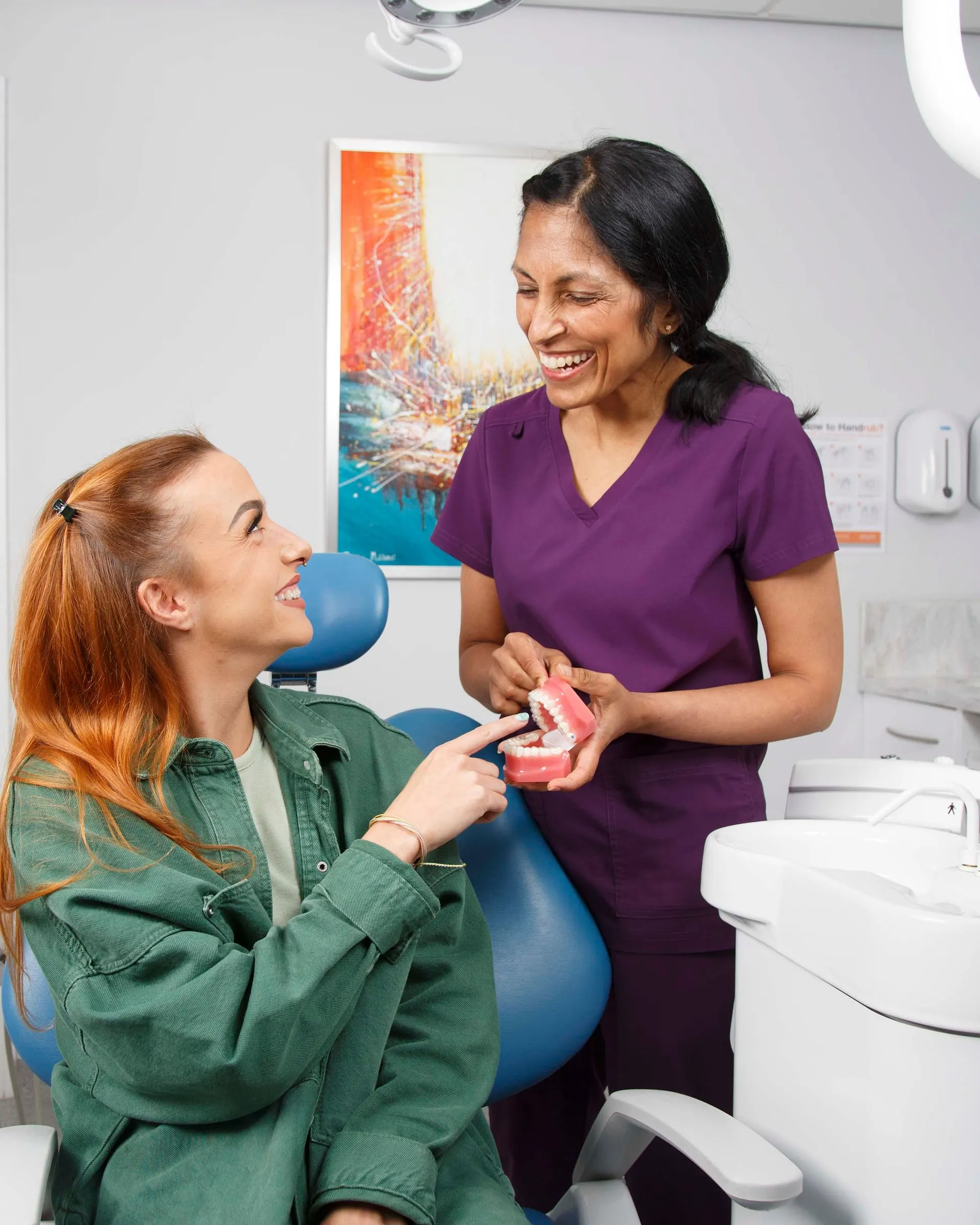 Dr Anjli Patel talking with a patient in the surgery, both smiling